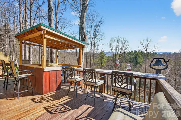 a view of a chairs and table on the deck