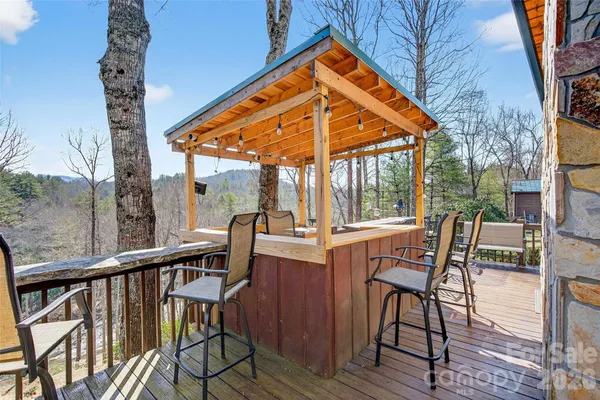 a view of balcony with furniture and wooden deck