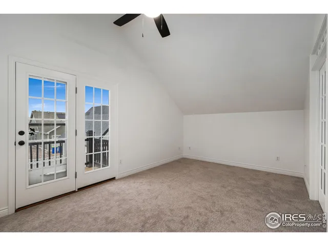 a view of an empty room with windows