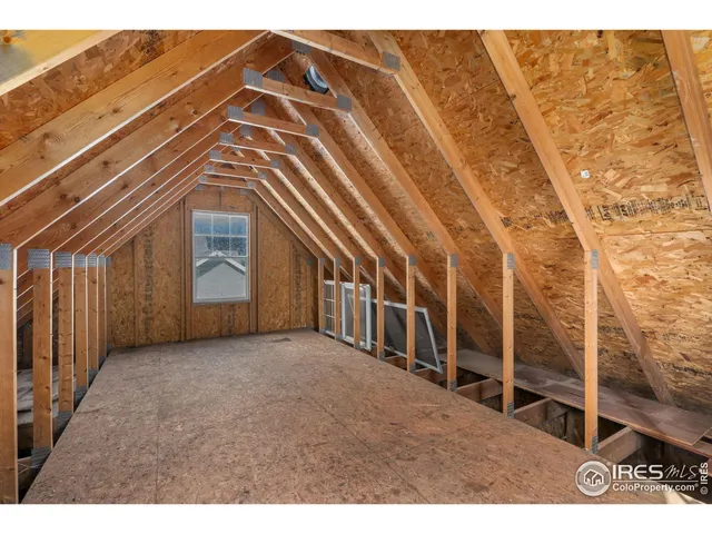 a view of a big room with wooden stairs
