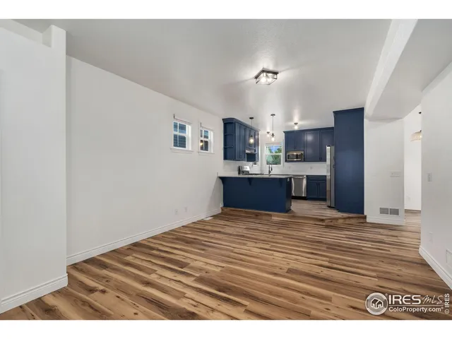 a view of kitchen with wooden floor