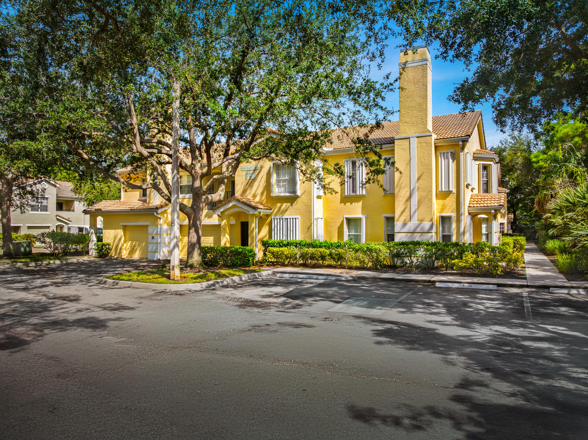 110 Southwest Peacock Boulevard, Unit 6102 Port St. Lucie, FL 34986 - Photo 2 of 40 a view of a building with a street