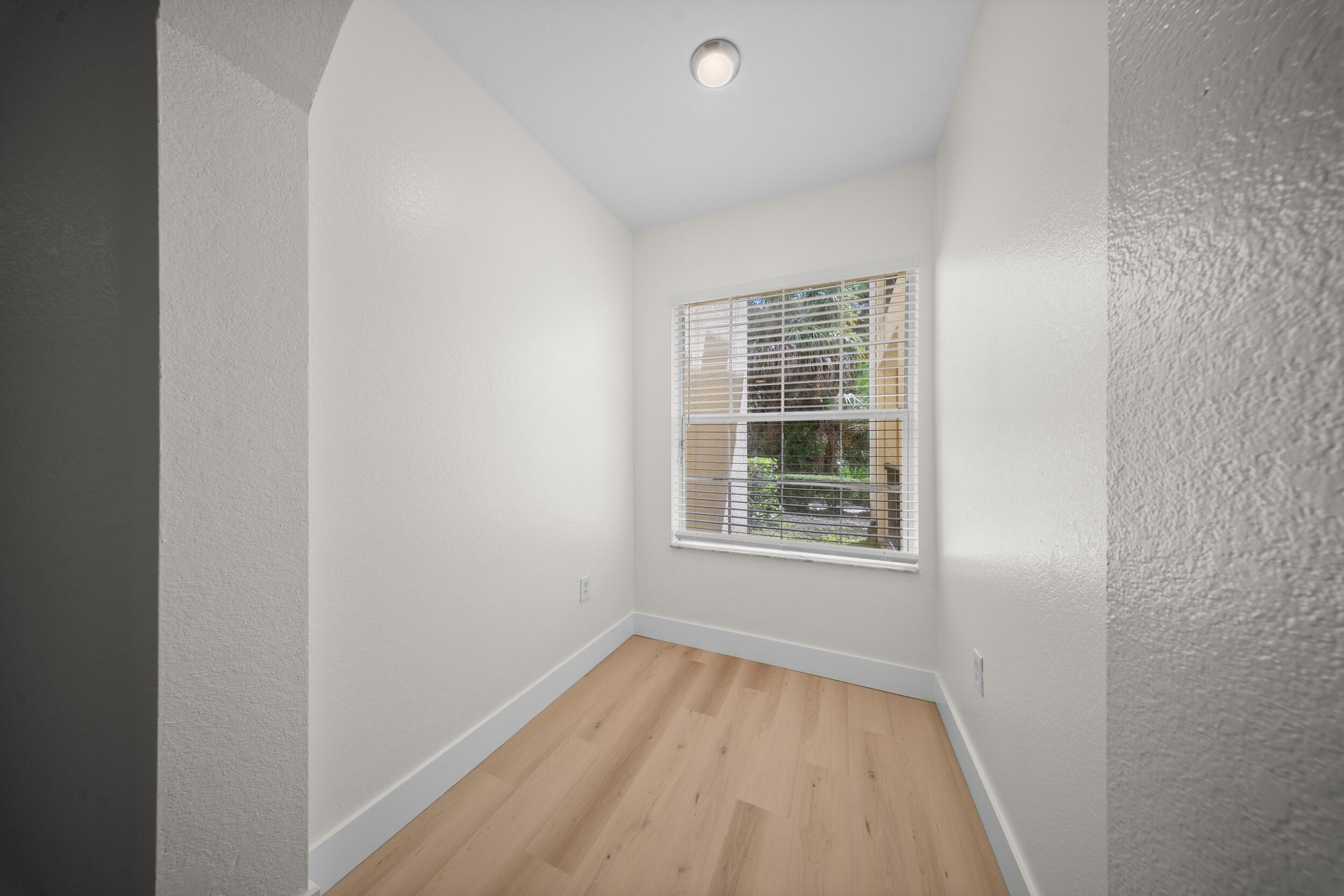 110 Southwest Peacock Boulevard, Unit 6102 Port St. Lucie, FL 34986 - Photo 24 of 40 an empty room with a window