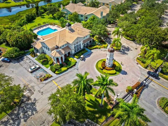 an aerial view of a swimming pool with a yard