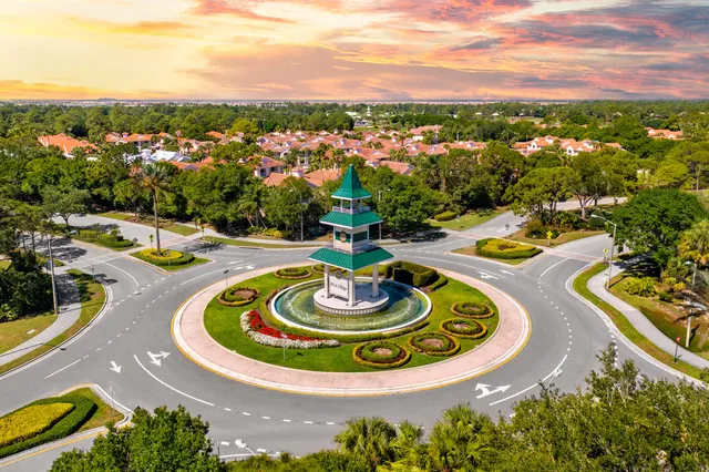 a view of a swimming pool with lounge chairs
