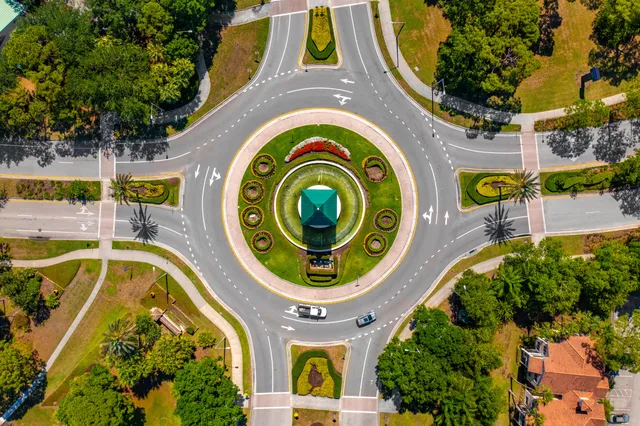 an aerial view of a house with a swimming pool and garden