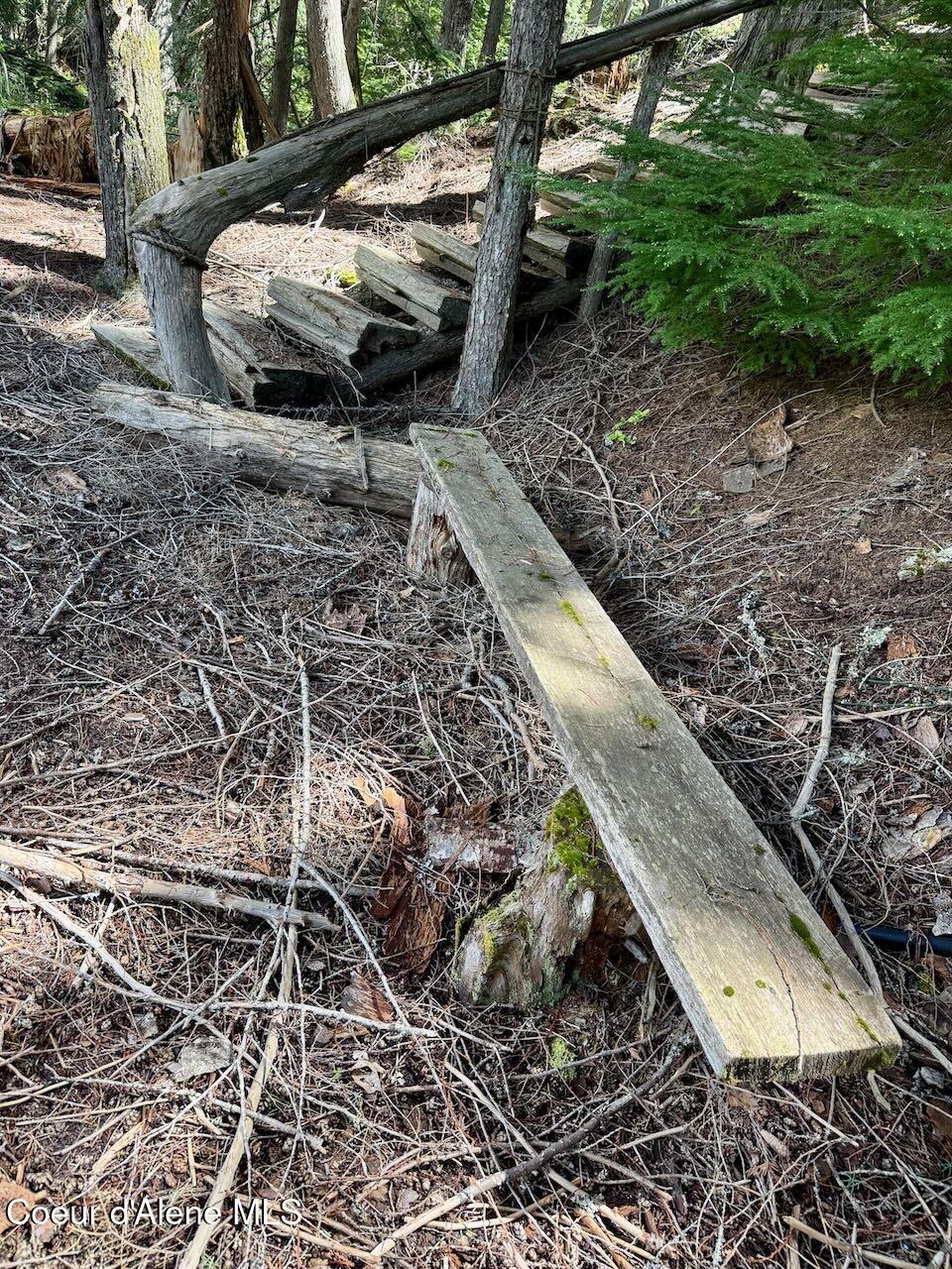 8213 Rapid Lightning Road Sandpoint, ID 83864 - Photo 36 of 40 Bench by creek