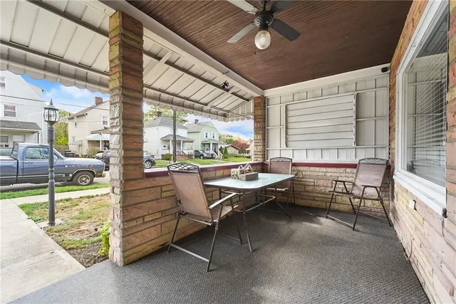 a balcony with furniture and a table