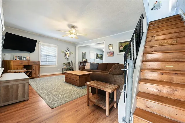 a living room with furniture and a flat screen tv