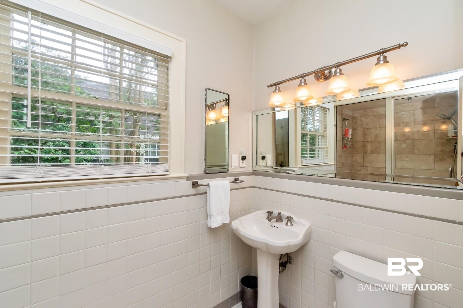 128 Silverwood Street Mobile, AL 36607 - Photo 24 of 34 Bathroom with tile walls, toilet, and plenty of natural light