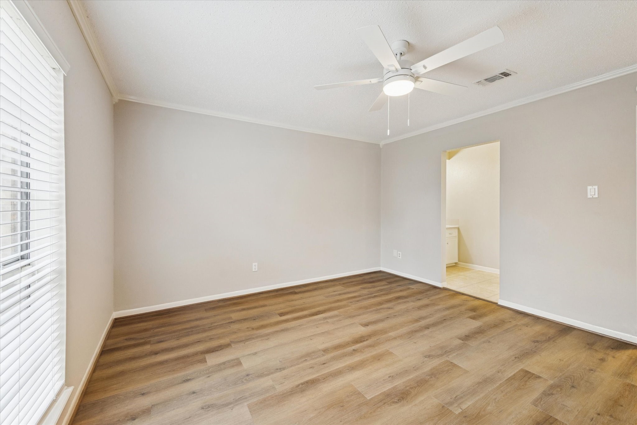 14722 Brown Road Tomball, TX 77377 - Photo 12 of 21 Additional view of the primary bedroom highlighting space and entrance to ensuite bath.