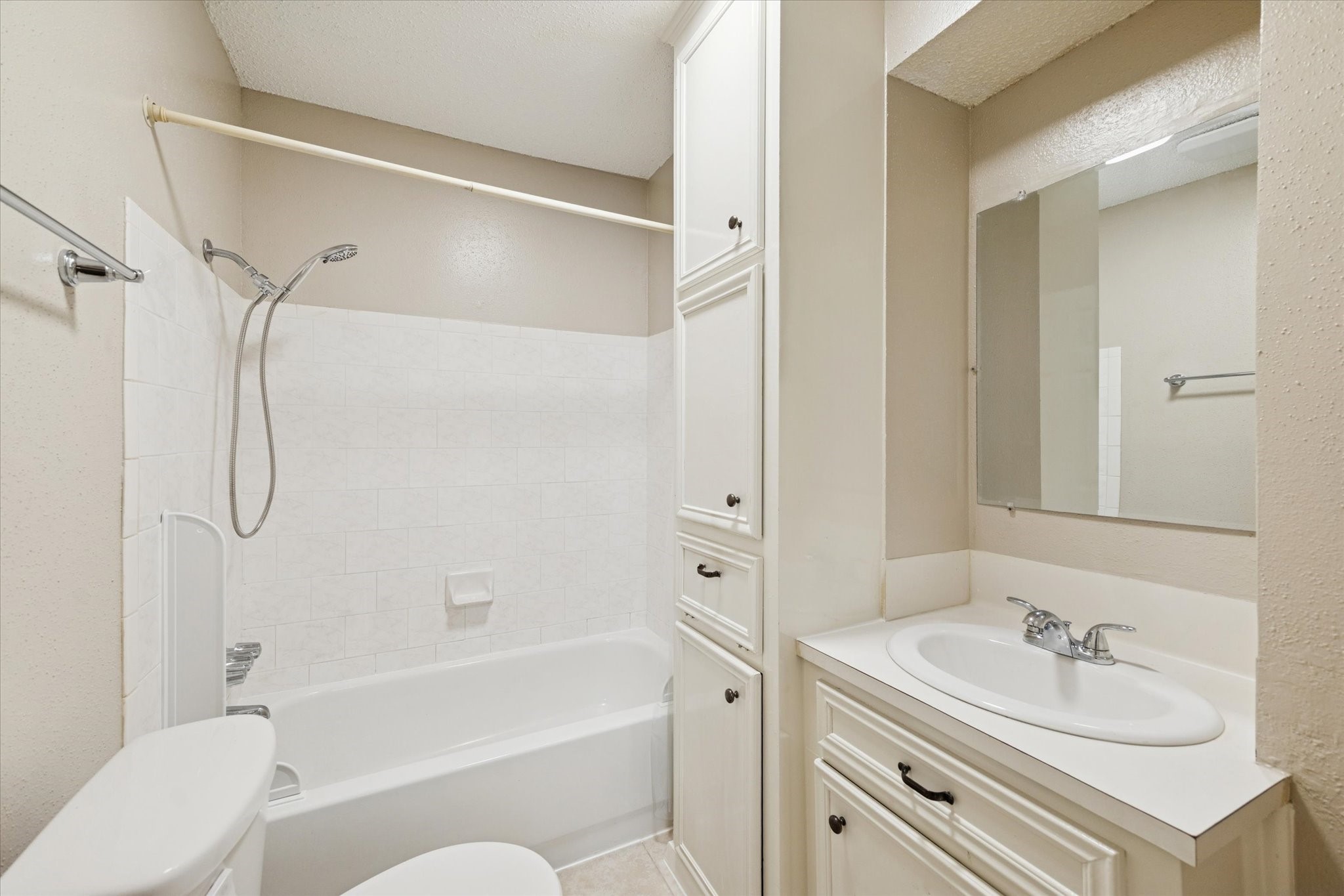 14722 Brown Road Tomball, TX 77377 - Photo 19 of 21 Second full bathroom with tub and shower combination and linen storage cabinet.