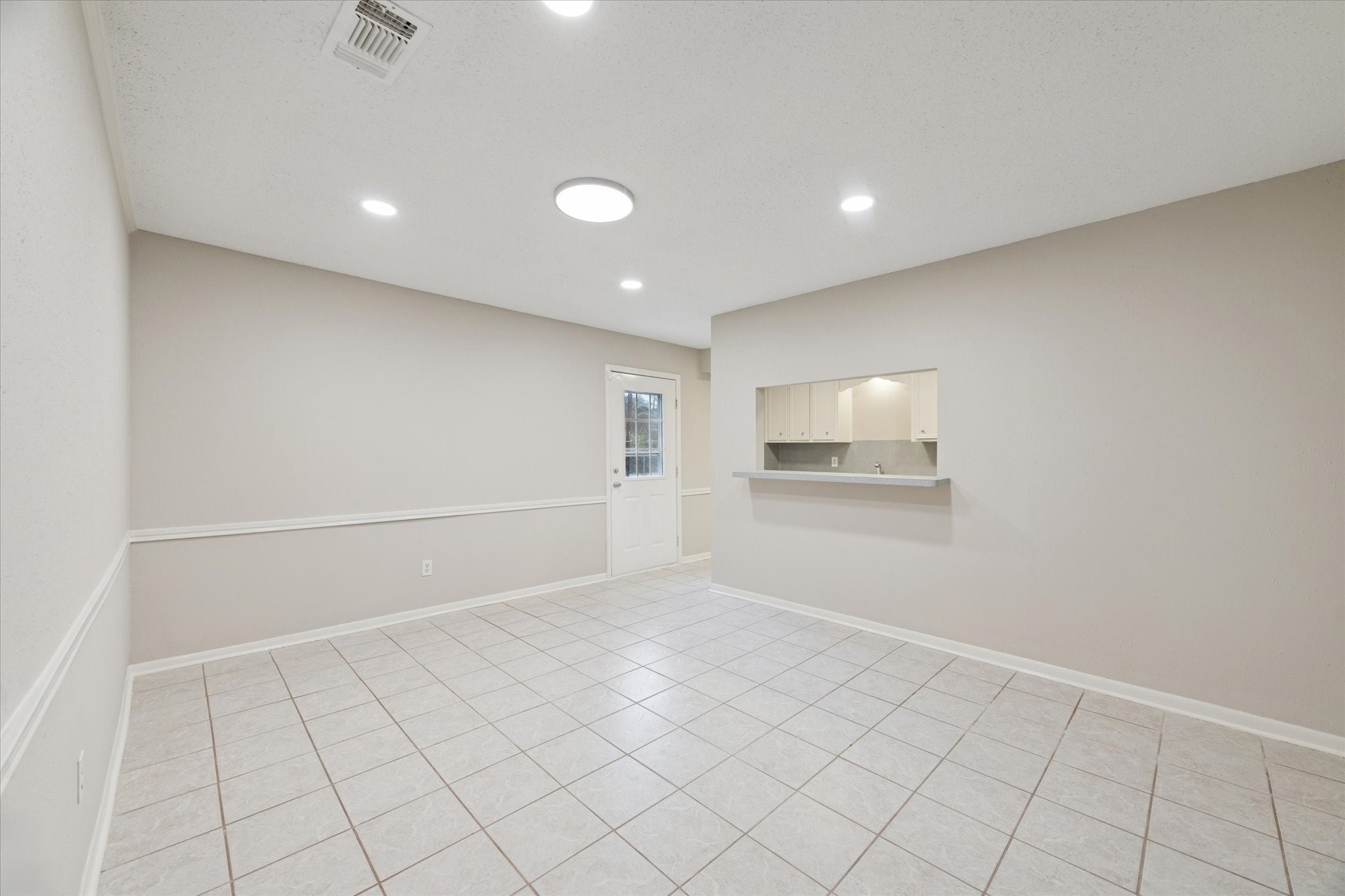 14722 Brown Road Tomball, TX 77377 - Photo 6 of 21 Large dining area with tile floors, open to the kitchen for easy entertaining.
