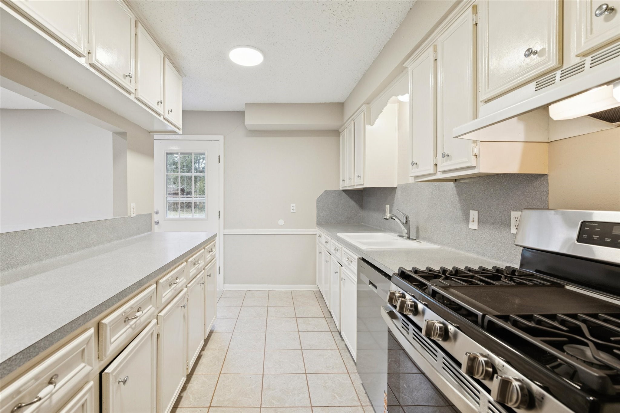 14722 Brown Road Tomball, TX 77377 - Photo 10 of 21 Alternate kitchen view showcasing layout and countertop workspace.