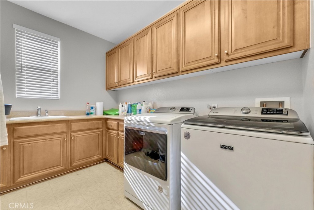 18388 Hidden Ranch Road Riverside, CA 92508 - Photo 29 of 46 a kitchen with stainless steel appliances granite countertop a sink and cabinets