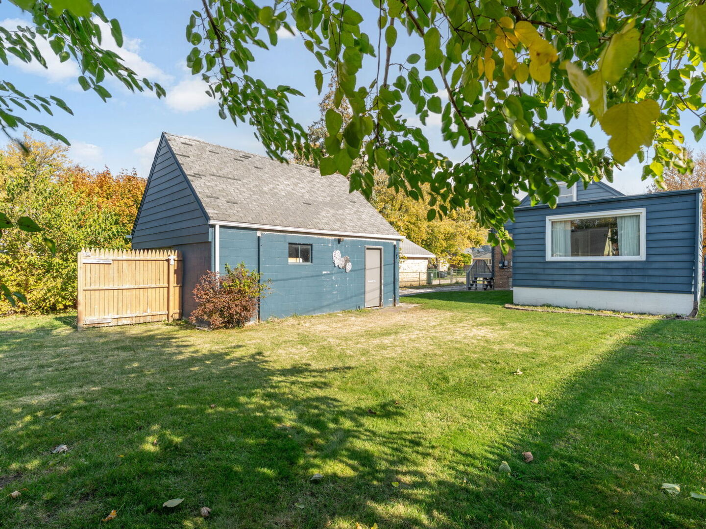 17816 Commercial Avenue Lansing, IL 60438 - Photo 16 of 17 a front view of a house with a garden and yard