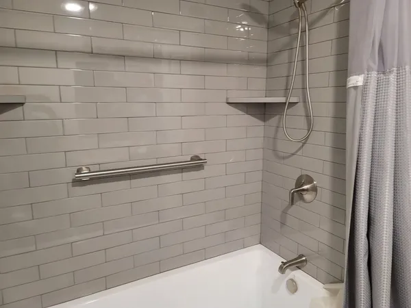 a bathroom with a shower and a bathtub