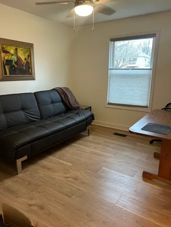 a living room with furniture and a window