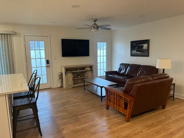 a living room with furniture and a flat screen tv
