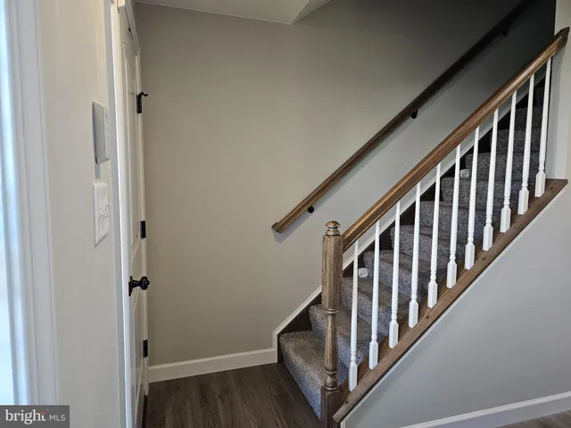 a view of an entryway with wooden floor