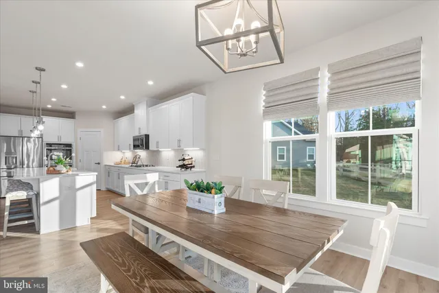 a spacious bedroom with a bed and a dresser