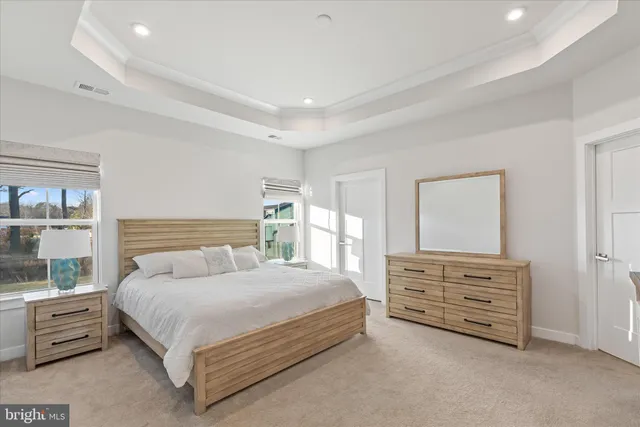 a living room with furniture gym equipment and a window