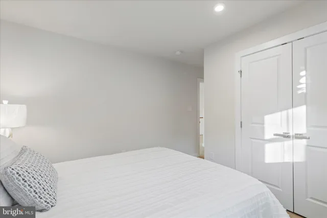 a living room with fireplace furniture and a wooden floor