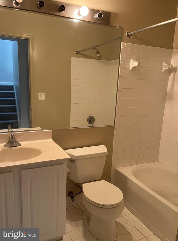 9163 Stone Garden Lorton, VA 22079 - Photo 13 of 25 a bathroom with a sink toilet and shower