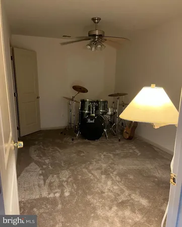 an empty room with a fireplace