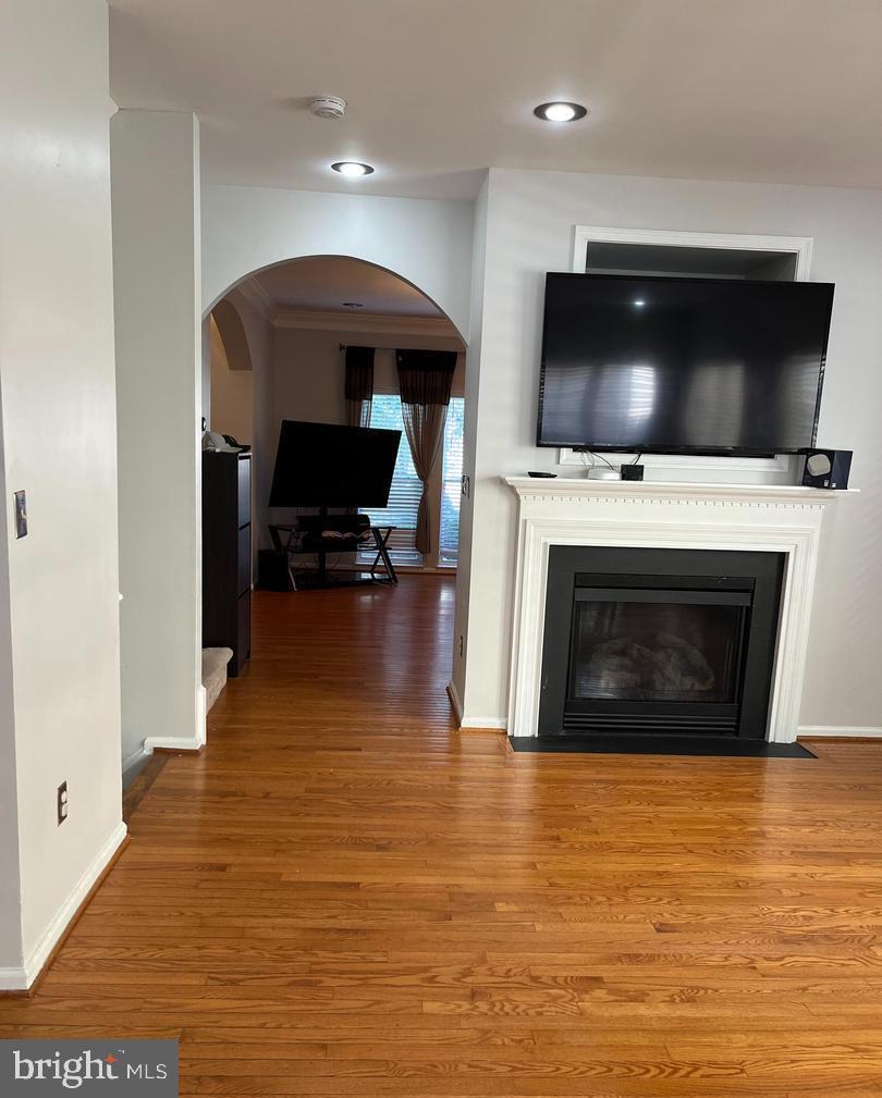 9163 Stone Garden Lorton, VA 22079 - Photo 4 of 25 a living room with furniture and a flat screen tv