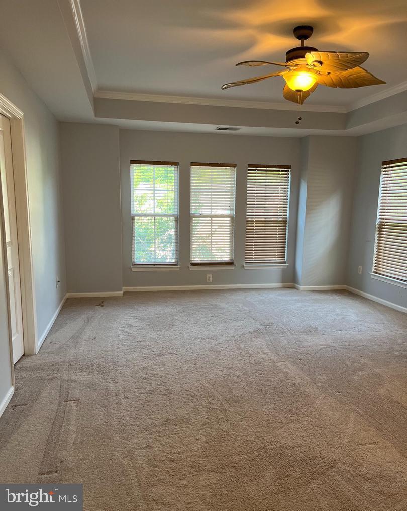 9163 Stone Garden Lorton, VA 22079 - Photo 10 of 25 a view of an empty room with window and cabinet