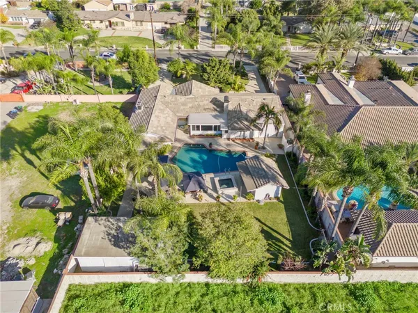 an aerial view of residential houses with outdoor space