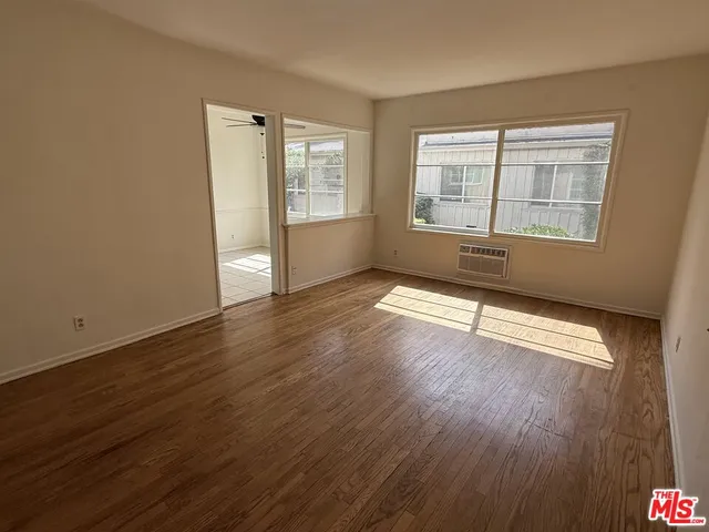 a very nice looking room with a ceiling fan