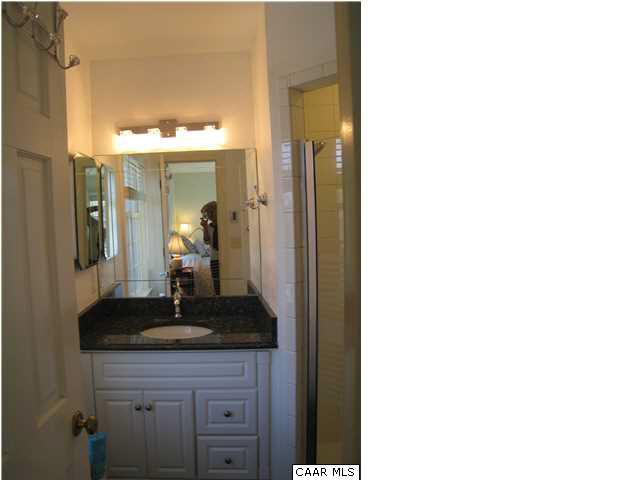 1828 Westview Road Charlottesville, VA 22903 - Photo 11 of 22 a bathroom with a granite countertop sink and a mirror