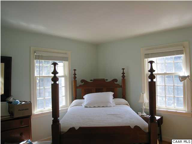 1828 Westview Road Charlottesville, VA 22903 - Photo 13 of 22 a bedroom with a bed and large windows