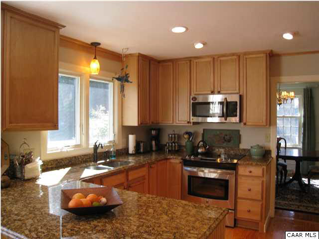 1828 Westview Road Charlottesville, VA 22903 - Photo 2 of 22 a kitchen with sink a stove and cabinets