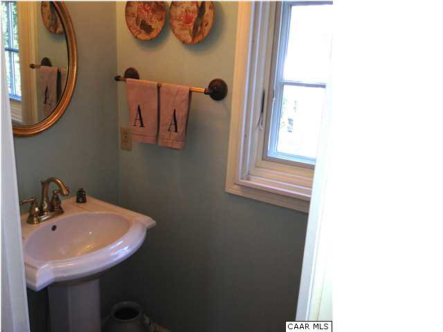 1828 Westview Road Charlottesville, VA 22903 - Photo 9 of 22 a bathroom with a sink and a mirror