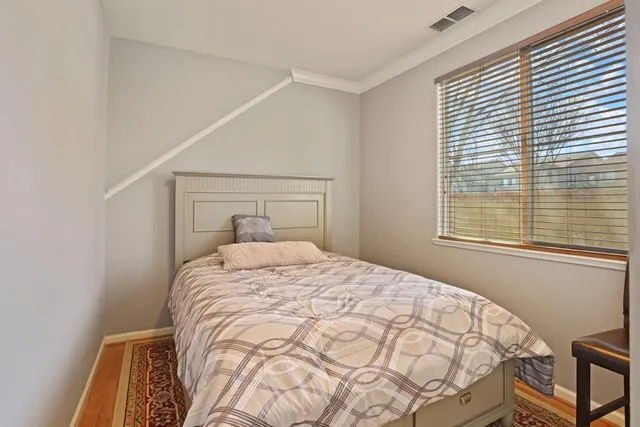 a living room with furniture a fireplace and a window