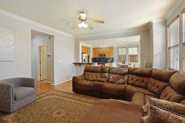a kitchen with stainless steel appliances granite countertop a sink a stove counter space and dining table