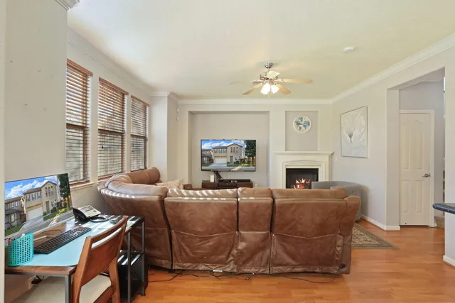 a kitchen with a table chairs and wooden floor