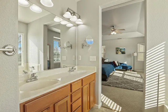 a bedroom that has a bed and chair