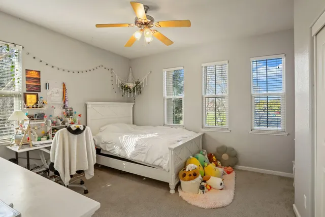 a bedroom with a bed and a dresser