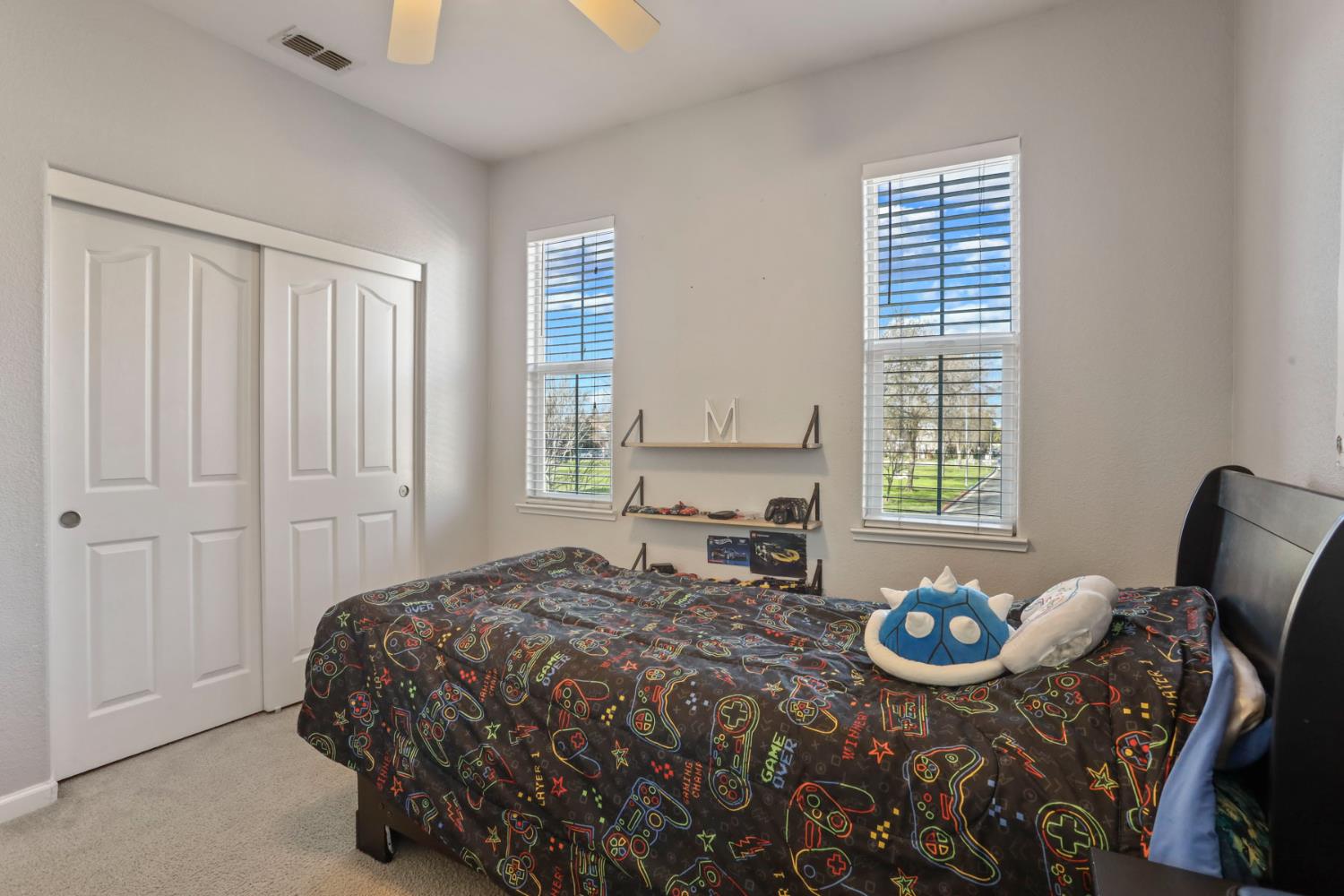 3144 Sweet Lilac Way Stockton, CA 95209 - Photo 45 of 76 a bedroom that has a bed and chair