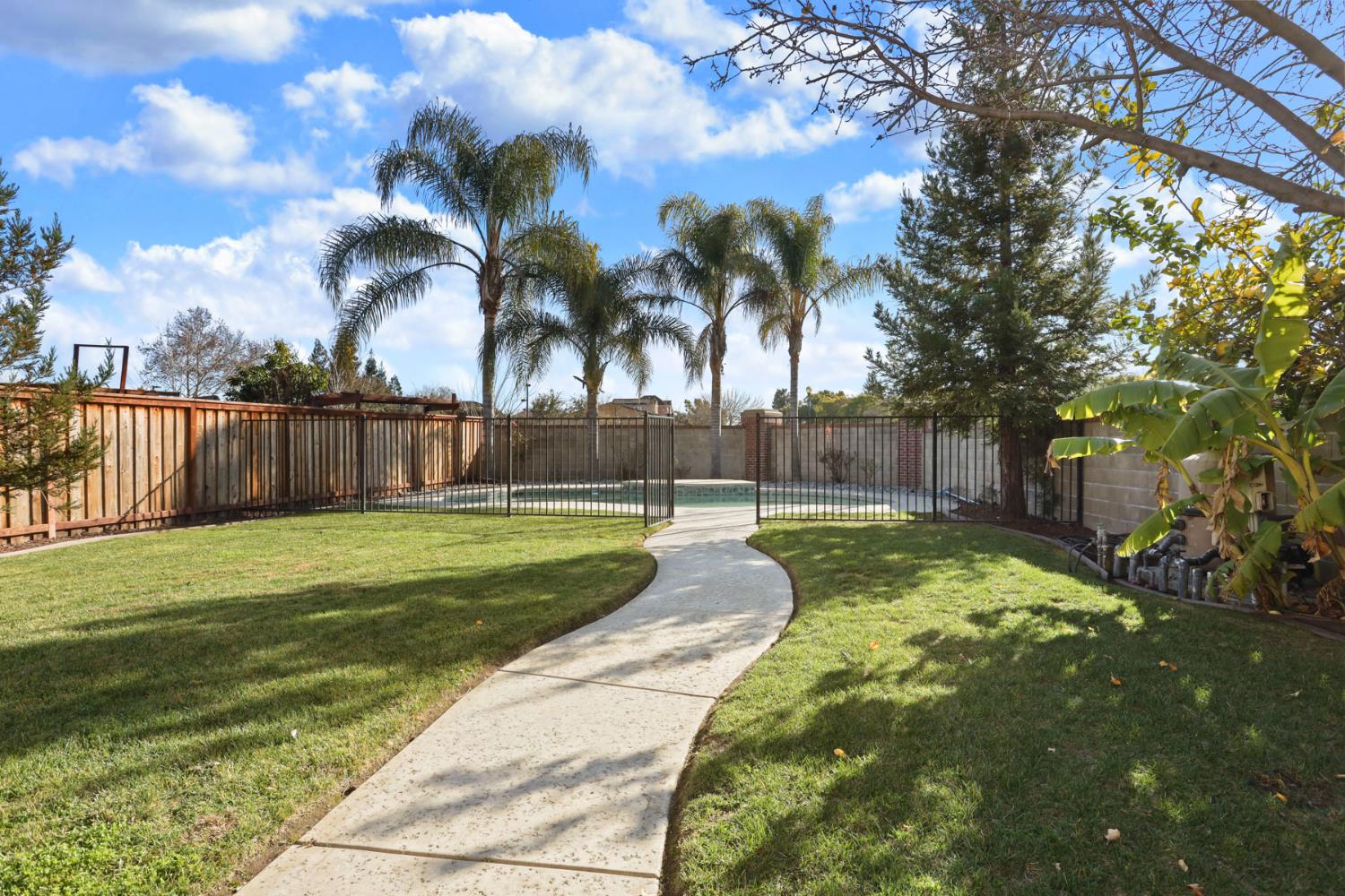 3144 Sweet Lilac Way Stockton, CA 95209 - Photo 50 of 76 a swimming pool with wooden fence