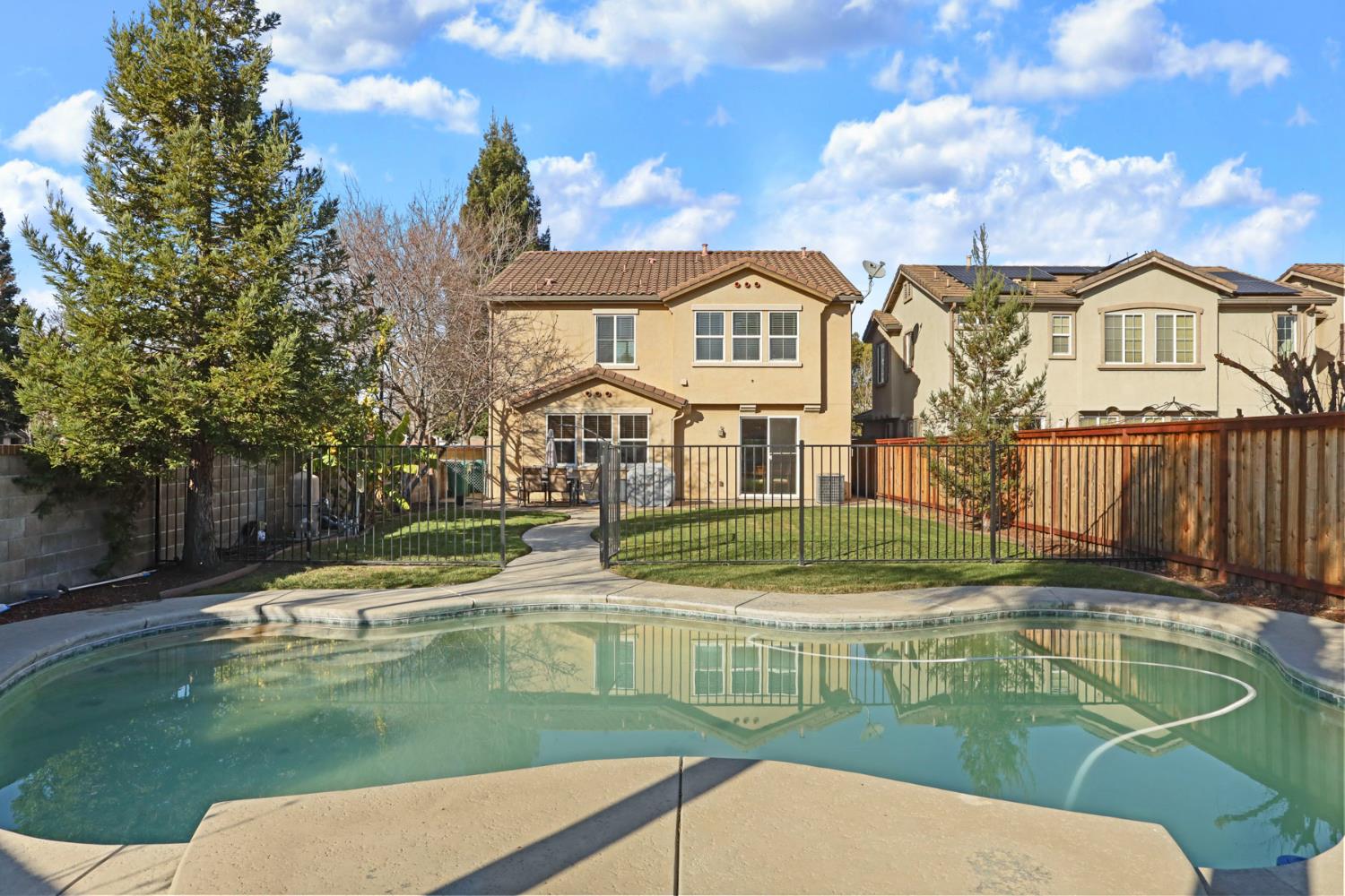 3144 Sweet Lilac Way Stockton, CA 95209 - Photo 55 of 76 a view of swimming pool with a yard