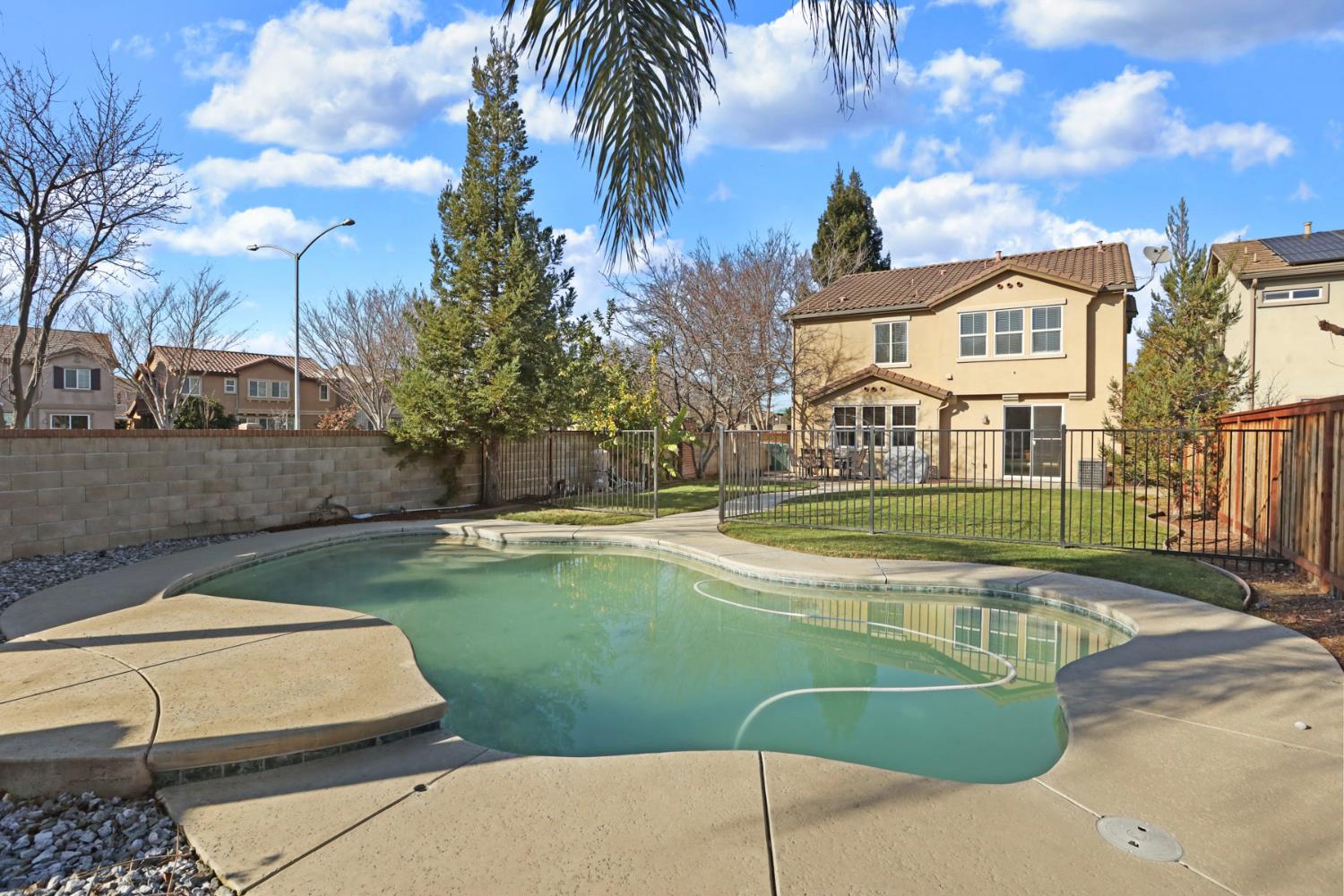 3144 Sweet Lilac Way Stockton, CA 95209 - Photo 56 of 76 a view of a house with swimming pool