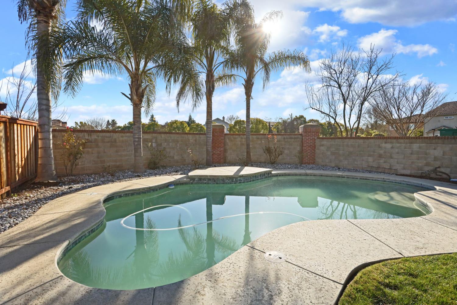 3144 Sweet Lilac Way Stockton, CA 95209 - Photo 57 of 76 a view of a swimming pool with a patio