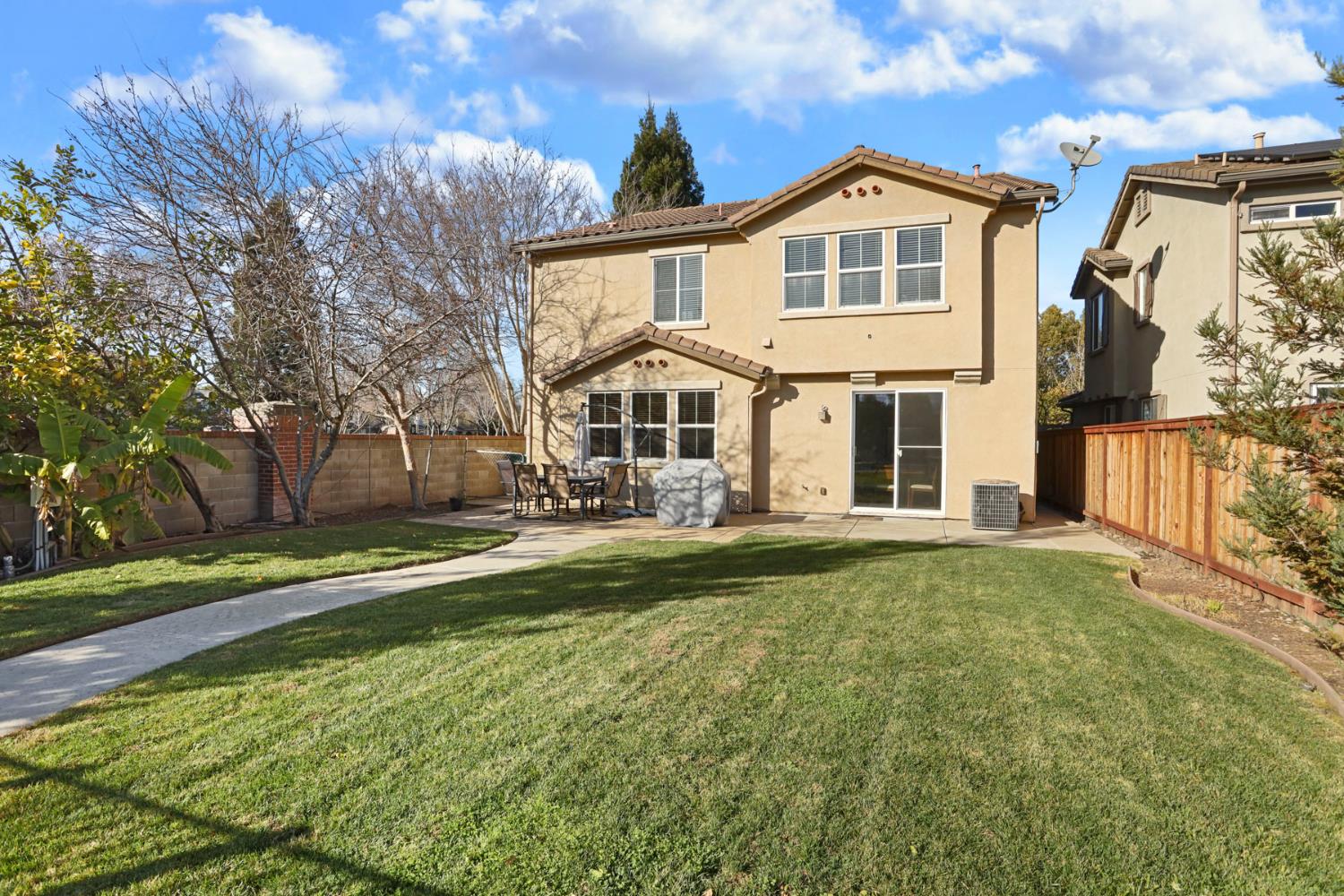 3144 Sweet Lilac Way Stockton, CA 95209 - Photo 58 of 76 a front view of a house with a yard