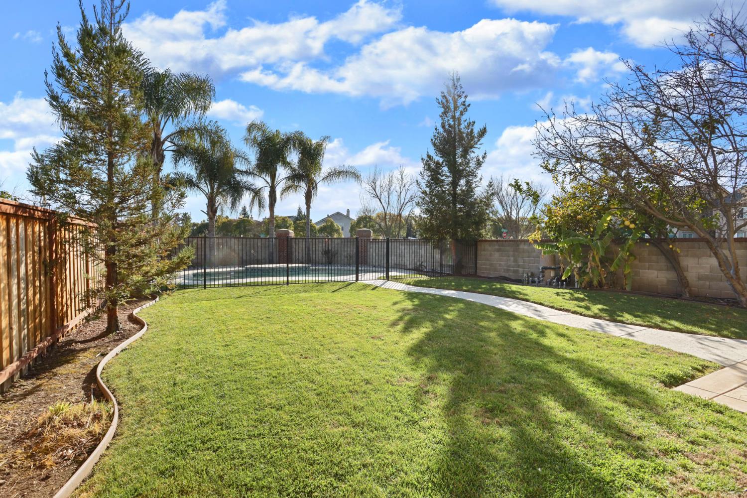 3144 Sweet Lilac Way Stockton, CA 95209 - Photo 59 of 76 a view of a swimming pool with an outdoor space