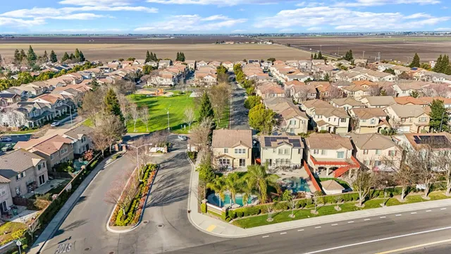 an aerial view of residential building and trees